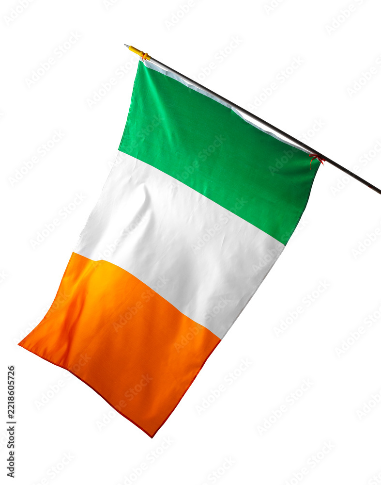 Fototapeta premium Irish flag displayed outdoors during daytime in a public area