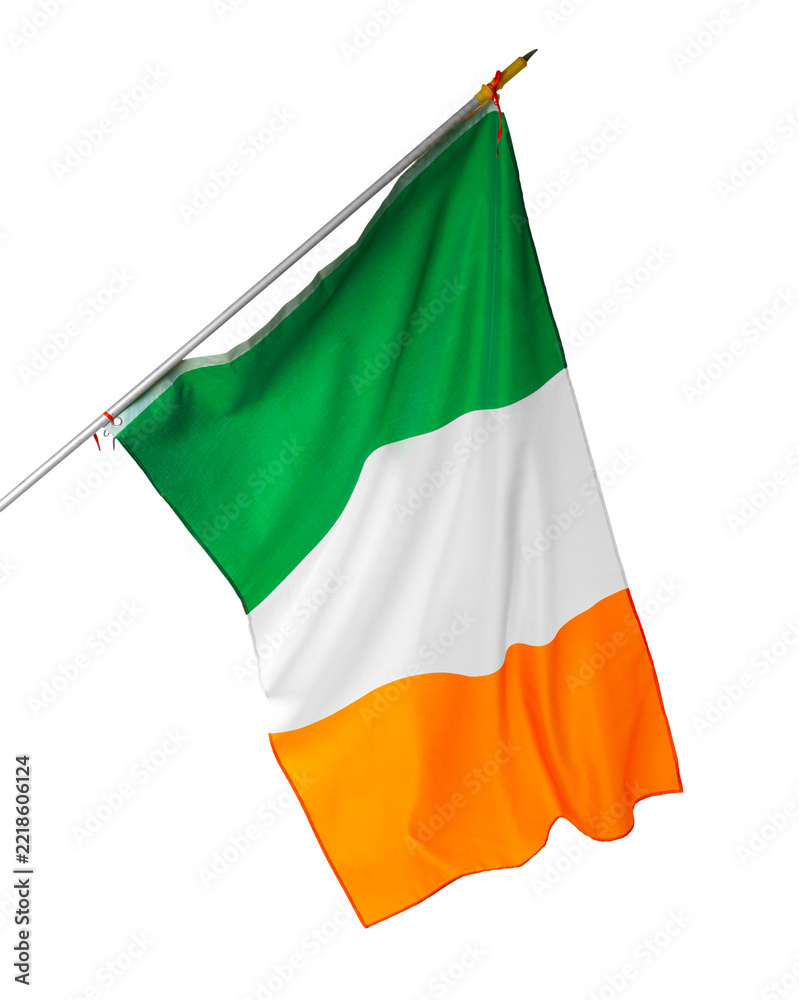 Fototapeta premium Irish flag waving on a flagpole against a plain background