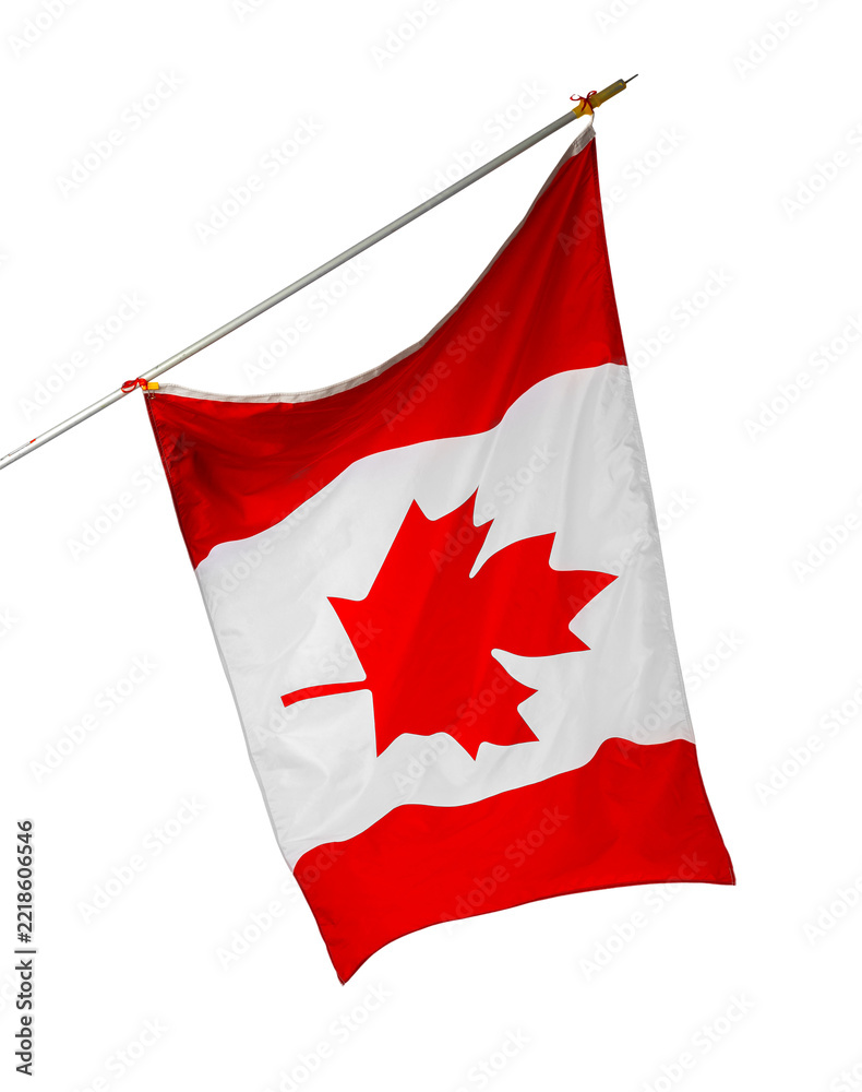 Fototapeta premium Flag of Canada waving in the air on a pole during a bright day
