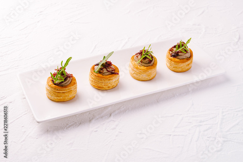 Vol-au-vent appetizers with liver pate and rocket