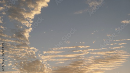Golden Clouds Across a Blue Gray Evening Sky
