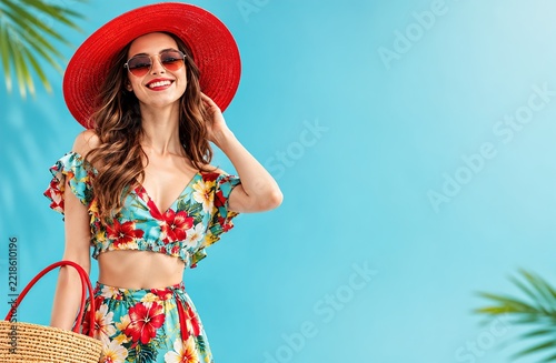 Woman in Red Hat and Colorful Tropical Swimwear Outfit