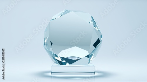 Crystal trophy stands on reflective base. Clean studio lighting highlights facets, creating bright visual impact. Simple, elegant presentation.