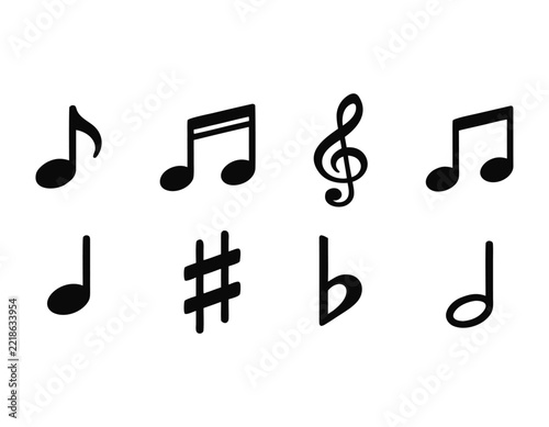 Black music notes and musical symbols set on white background for design projects.