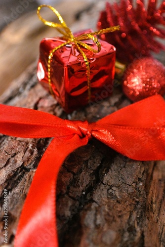 red christmas deco on firewood background  - merry christmas background - christmas card background 