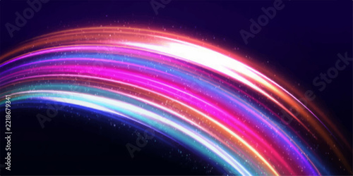 Colorful light trails arc across a dark background, creating a dynamic abstract pattern that evokes speed and energy.