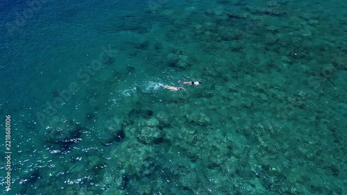 Couple Snorkeling in Clear Turquoise Water Top View
