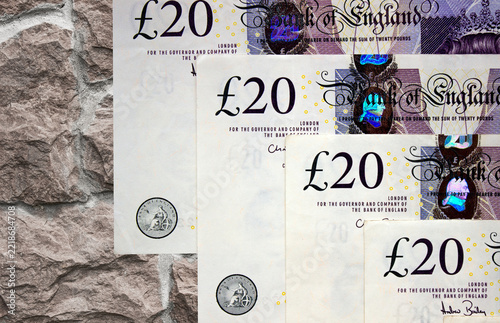 British pounds close-up on a chessboard background. National currency of Great Britain	

