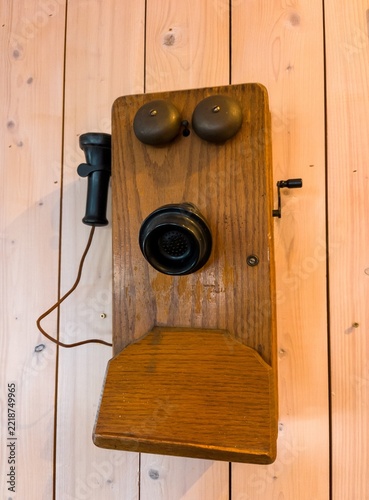 Vintage Antique Wooden Wall Phone Mounted on Timber Wall