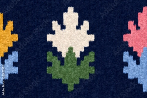 A woolen sweater with a colorful pattern of leaves on it. the pattern is a variety of colors including blues greens yellows and pinks creating a vibrant and eyecatching design.