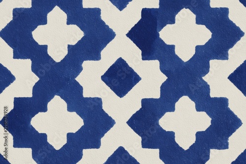 A blue and white ikat fabric with a geometric pattern. the fabric has a design with a blue white and cream colors. the pattern is intricate and detailed with a repeating geometric design that creates.