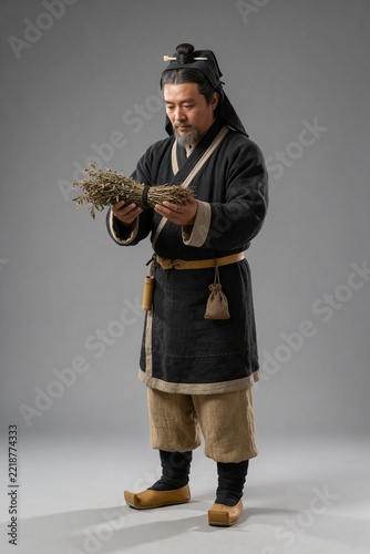 Chinese Qin Dynasty Shaman-physician Holding Medicinal Herbs