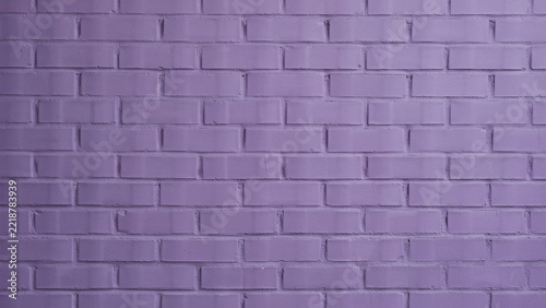 Solid lavender painted brick wall with mortar lines