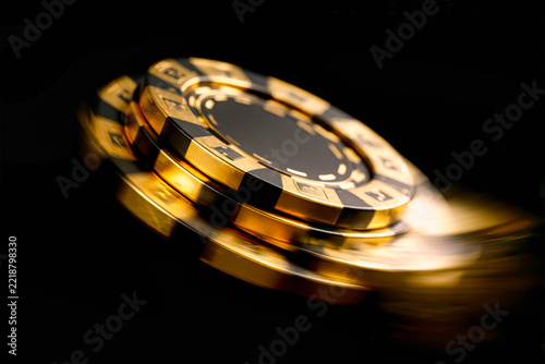 A golden casino chip appears to fly through the air, set against