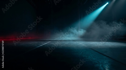 Empty stage with blue spotlight and fog in dark concert hall