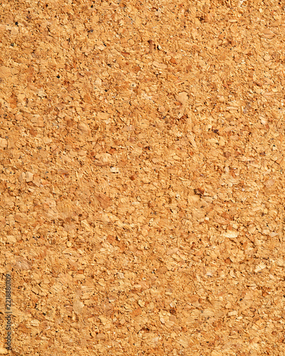 Natural cork board surface with light and dark granules close-up