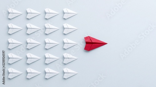 Top Down View of a Red Paper Airplane Leading a Group of White Paper Airplanes, Representing Leadership, Business Strategy, Uniqueness, and Visionary Direction on a Clean Neutral Background