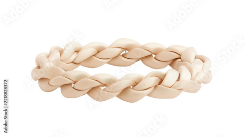A delicate pale cream colored soft textile intricately braided circular band with distinct woven texture, meticulously isolated for versatile design projects