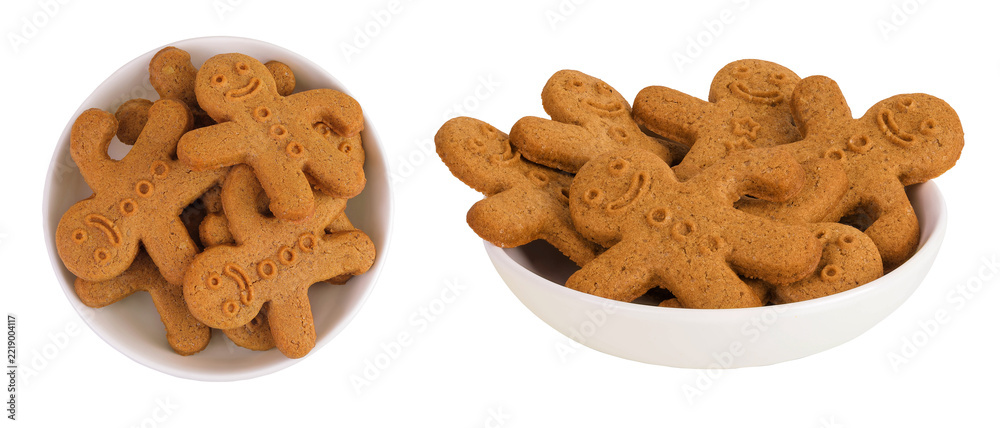 Fototapeta premium Gingerbread man in ceramic bowl isolated on white background. Top view. Flat lay.