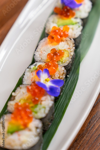 Maki sushi rolls with orange caviar