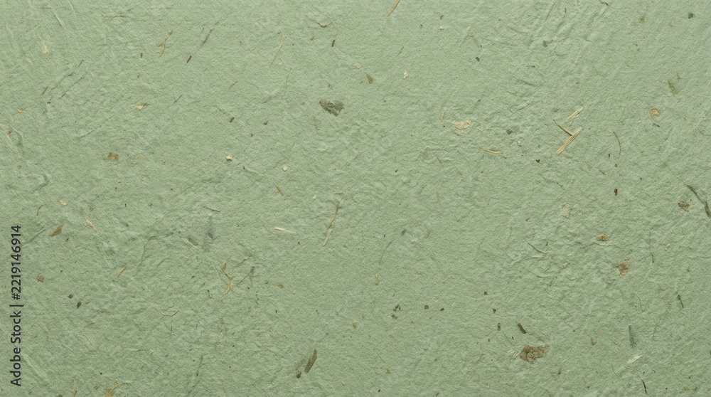Fototapeta premium Light green handmade paper texture with visible organic fibers and recycled material particles for artistic backgrounds
