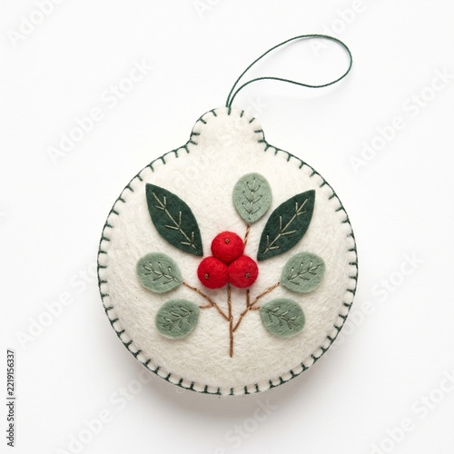 Handmade White Felt Christmas Ornament with Green Stitched Border and Berries.