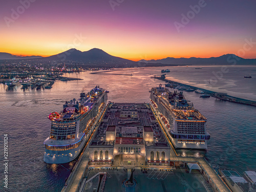 Sunrise in Naples harbour, Italy. Cruise ships docked in Naples harbour at sunrise with Mount Vesuvius on the horizon, Italy, photographed on 3 October 2026.
