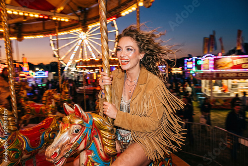 Carousel Ride with Smiling Woman at Night Fair
