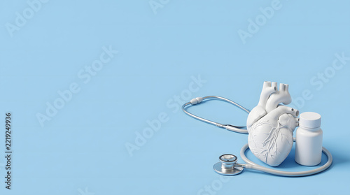 White anatomical heart model with stethoscope and medicine bottle for