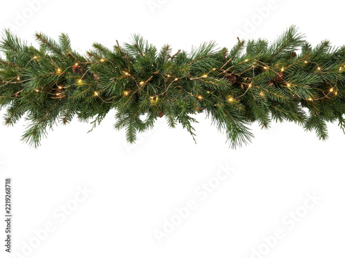 Christmas garland with pine branches and warm fairy lights isolated on transparent background