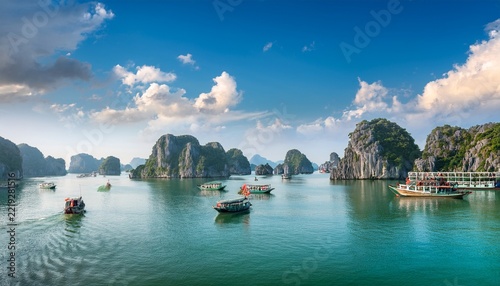 ha long bay halong bay world heritage site limestone islands emerald waters with boats in qu ng ninh province vietnam travel destination natural wonder landscape background wallpaper