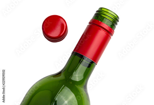 Open Green Wine Bottle with Red Screw Cap Flying Off isolated on White Background