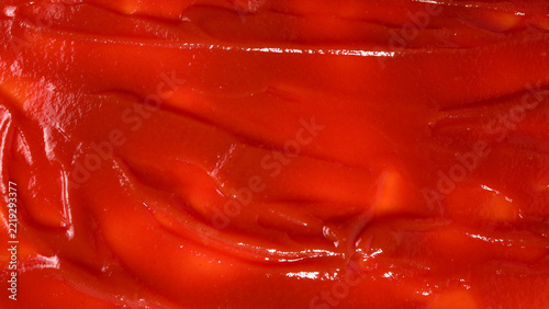 Red sauce splashes as background.