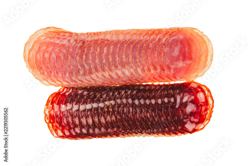 Two rows of sliced sausage isolated on a white background. Salami, ham, and bacon slices arranged in lines, top view, deli meat.