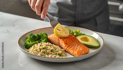 Healthy Salmon Plate with Quinoa Broccoli and Avocado.