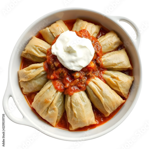 Traditional Ukrainian holubtsi stuffed cabbage rolls in tomato sauce isolated on white background.