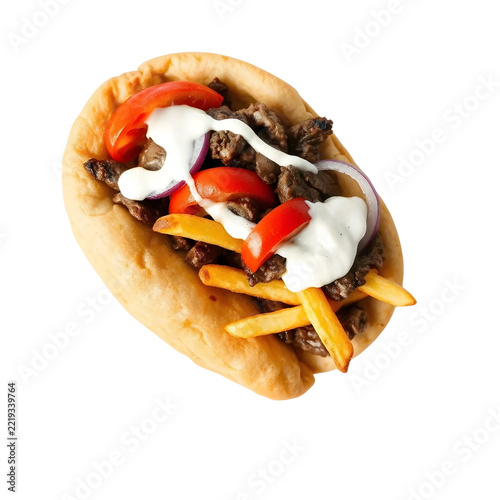 Traditional Greek gyro wrap with seasoned meat, tzatziki, tomatoes and onions isolated on white background.