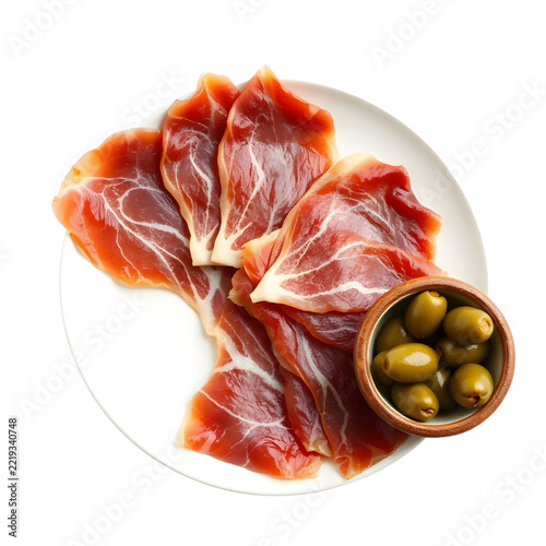 Thinly sliced jamón ibérico cured ham isolated on white background.
