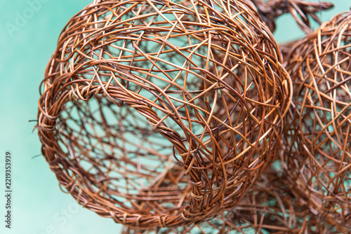 Handcrafted wicker spheres with a geometric weave