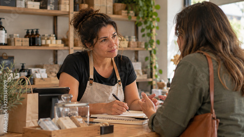 Small Business Owner Listening to a Customer in an Artisan Retail Shop