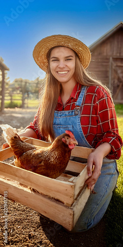 woman holding a chicken