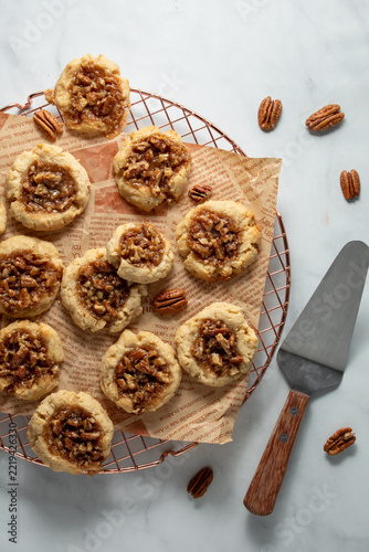 Homemade Pecan Pie Cookies on a parchment paper covered cooling rack.