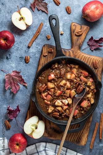 A frypan of a caramel apple butter pecan topping for French toast. 