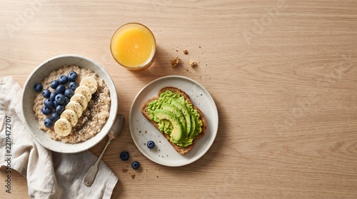 Healthy breakfast spread with oatmeal porridge, avocado toast, and fresh orange juice.