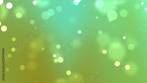 Green and teal bokeh particles gently float through a soft colorful background, creating a fresh luminous abstract motion backdrop