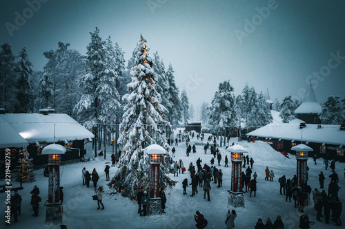 Snowfall Over Santa's Village Square