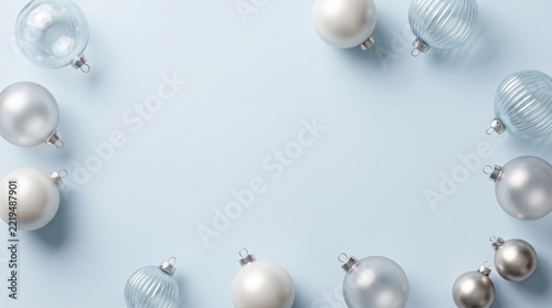 Silver and clear christmas baubles on light background isolated on white background