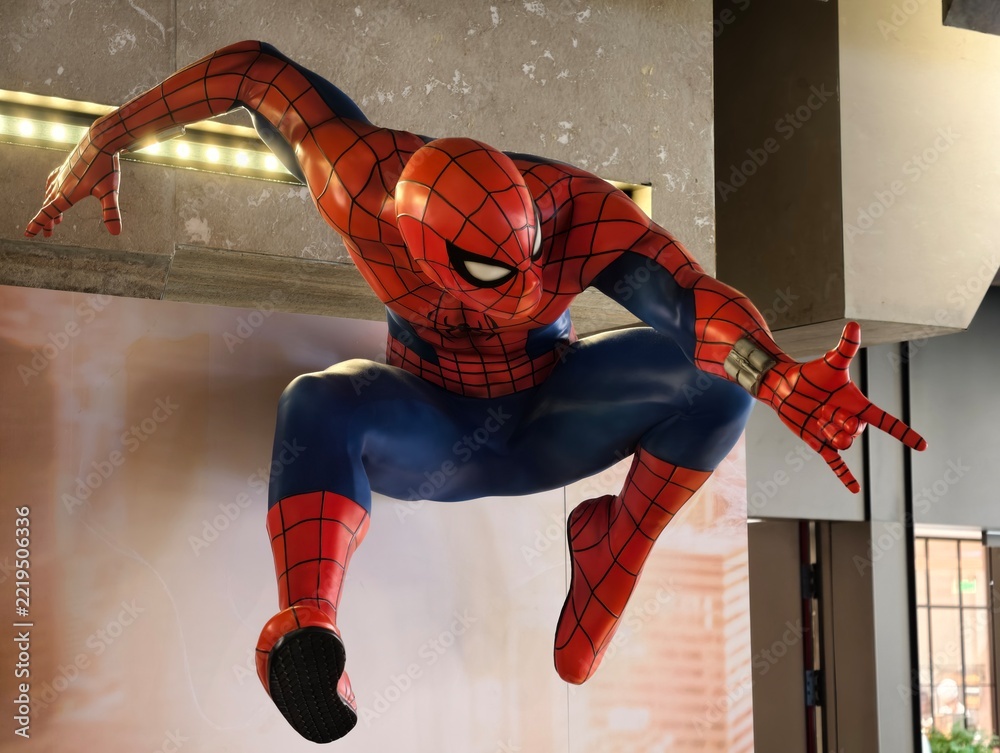 Naklejka premium Wuhan, China-Oct.6th 2026: Close-up of a Spider-Man superhero action pose statue in cinema