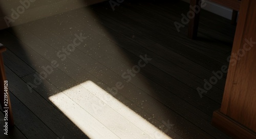 Sunlight streaming through a window onto a white surface in a dimly lit room.