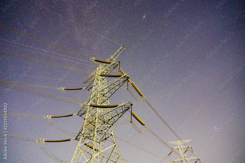 Obraz premium Power pylon starry sky electric tower